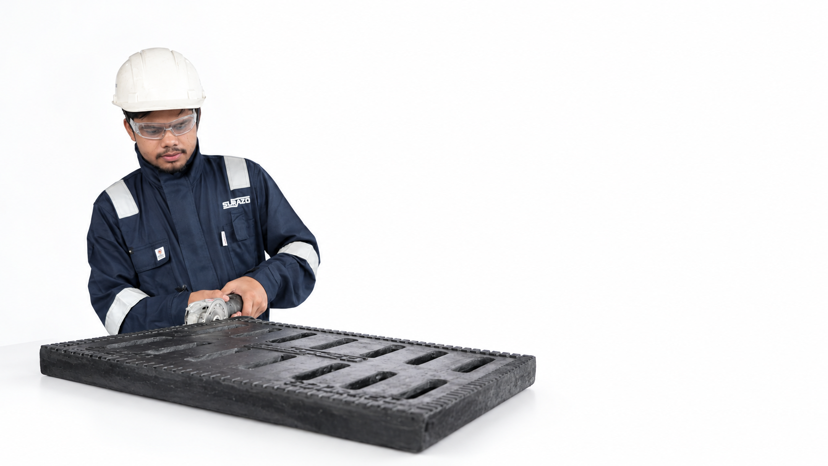 Surazo worker finishing a composite drainage cover against a clean white background